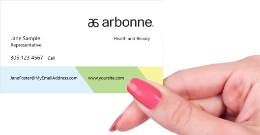 Hand holding business card -  Arbonne consultant