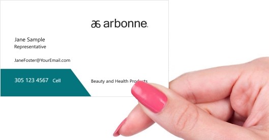 Hand holding business card -  Arbonne health and beauty