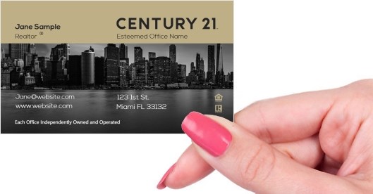 Hand holding business card -  Century 21 Development business card