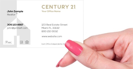 Hand holding business card -  Century 21 Residential Commercial business card