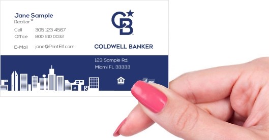 Hand holding business card -  Coldwell Banker downtown business card