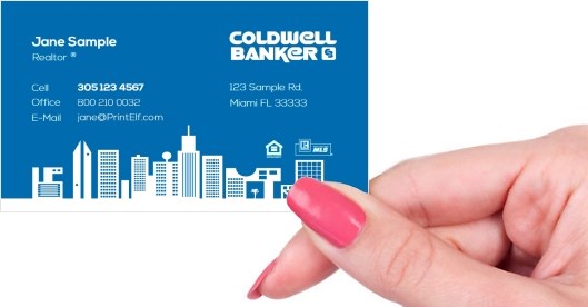 Hand holding business card -  Coldwell Banker Real Estate business card