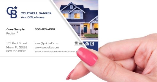 Hand holding business card -  Coldwell Banker residential business card