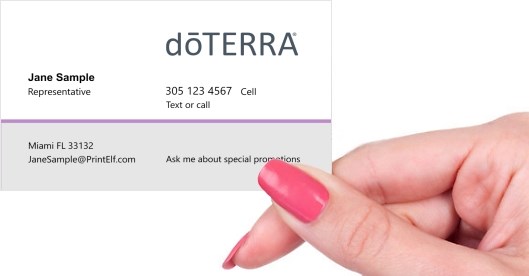 Hand holding business card -  doTERRA affiliate