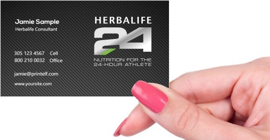 Hand holding business card -  Herbalife-carbon