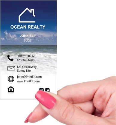 Hand holding business card -  Ocean Realty business card