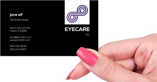 Hand holding business card -  Ophthalmologist Eye business card