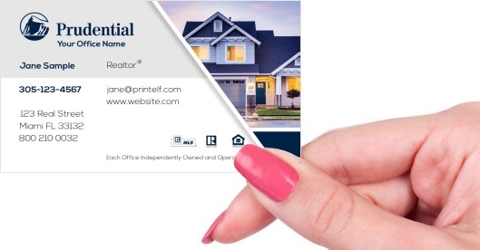 Hand holding business card -  Prudential Estate Agent business card