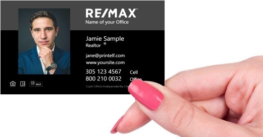 Hand holding business card -  Remax black business card