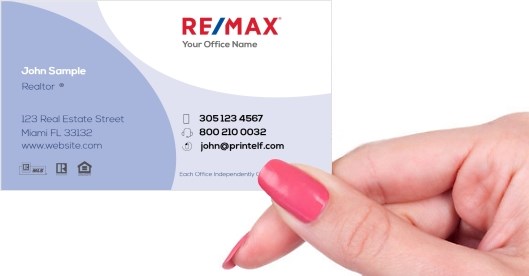 Hand holding business card -  Remax Development Business Card