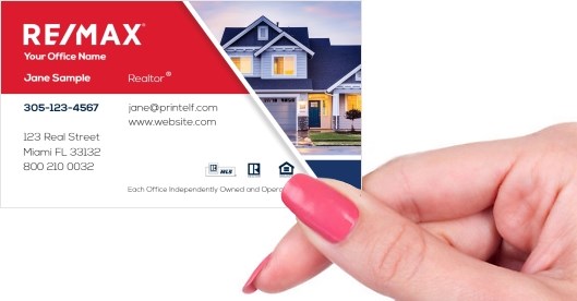 Hand holding business card -  ReMax estate agent business card