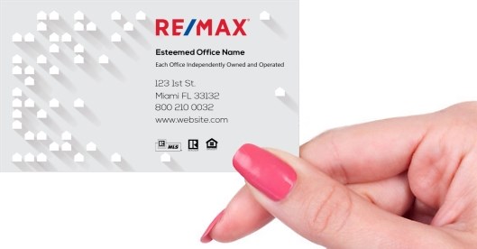 Hand holding business card -  ReMax real estate business card