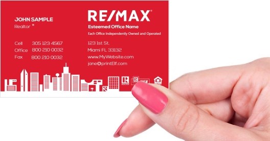 Hand holding business card -  ReMax red business card