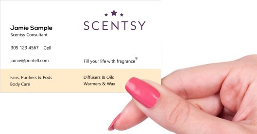 Hand holding business card -  Scentsy Consultant